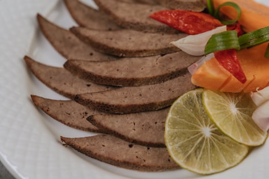 Grilled Liver Slices , carrots, chili, spring onions, and mint. photo