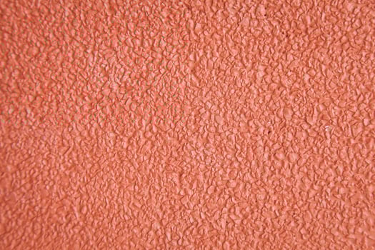 A close up of a red painted wall photo
