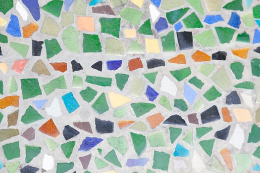 A mosaic tile pattern with many different colors photo