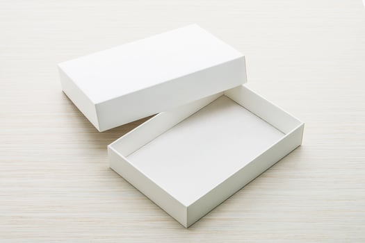 Open white box on wooden surface photo