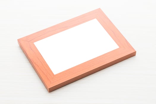 A wooden frame with a blank white sheet on top photo