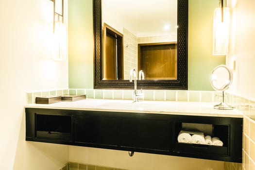 A bathroom with a sink and mirror photo