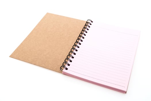 A pink notebook with a spiral bound cover photo