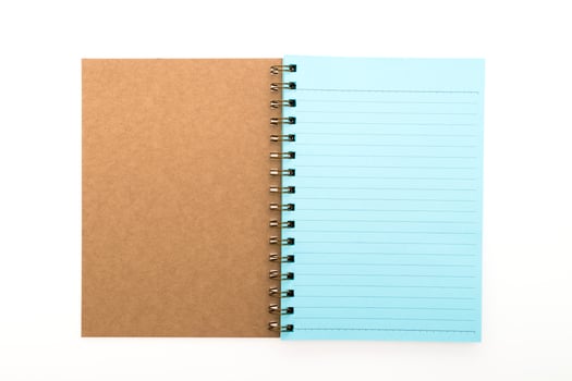 A notebook with a blue cover and a brown cover photo