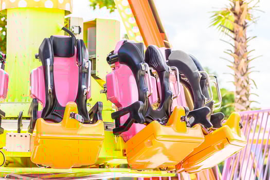 A ride with a bunch of seats on it photo