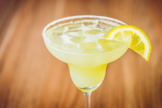 A margarita with a lemon slice on top photo
