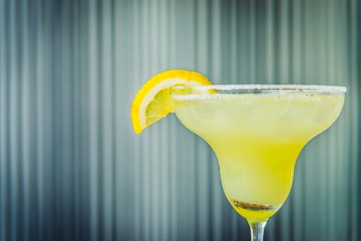 A margarita with a lemon slice on top photo