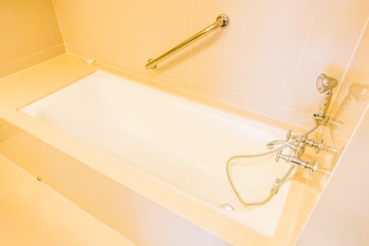 A bathroom with a bathtub and a shower photo