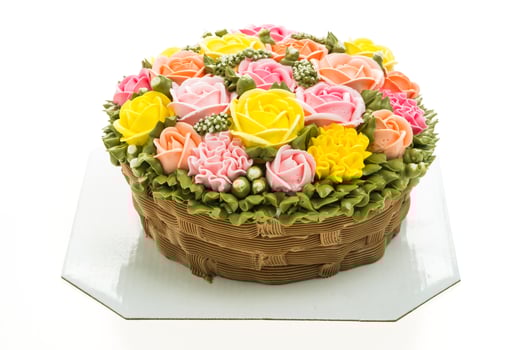 A cake with flowers on top of a white plate photo