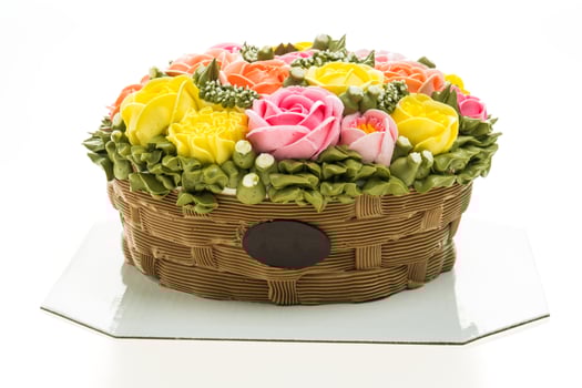 A cake with flowers in a basket on a plate photo