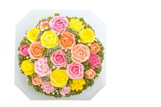 A bouquet of colorful roses on a white surface photo