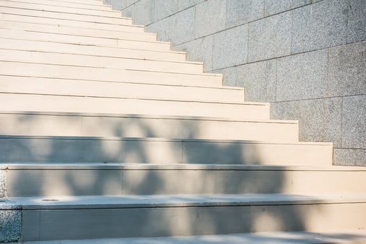 A close up of a set of stairs with a shadow photo