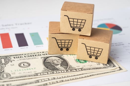 Shopping cart logo on box with US dollar banknotes and graph, Banking Account, Investment Analytic research data economy, trading, Business import export online photo
