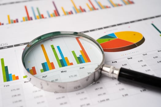 Magnifying glass on charts graphs paper. Financial development, Banking Account, Statistics, Investment Analytic research data economy, Stock exchange photo