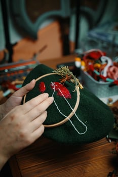 Embroidery process with cotton thread of mushrooms hat. photo
