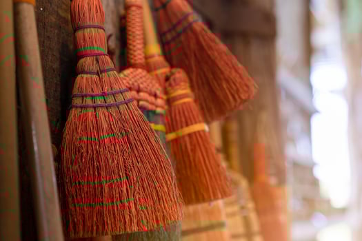 Broom hanging on the wall photo