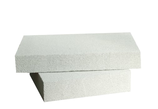 Lightweight construction brick isolated on white. Lightweight foamed gypsum block isolated on white. photo