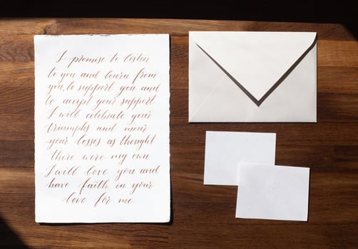 Wedding details flat lay on wooden background. Wedding invitation. Wedding bouquet. Mock up. Envelope. Copy space. photo