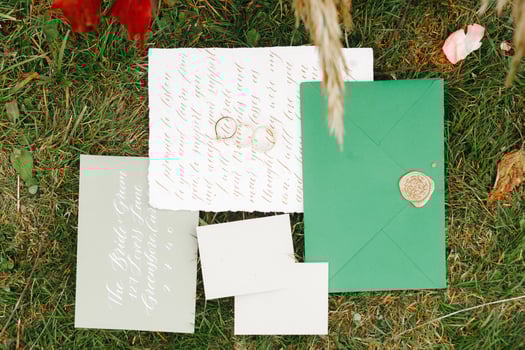 Wedding details flat lay. Wedding invitation. Ring box. Wedding bouquet. Mock up. Envelope. Copy space. photo
