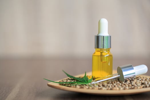 cannabis CBD oil hemp products, cannabis oil extracts in jars,  patient medical marijuana and oil.  alternative remedy or medication, medicine concept photo
