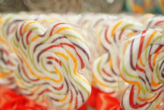 Shop window with coloured lollipops on stick. photo
