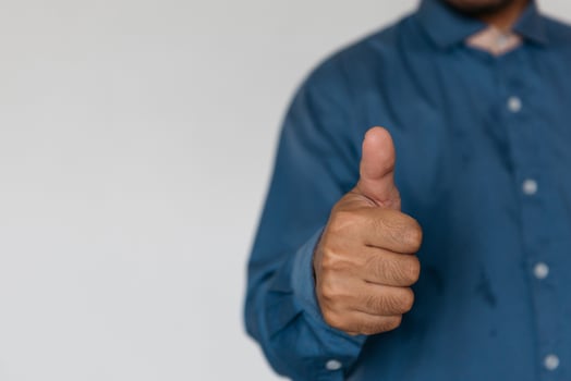 Young handsome man wearing light blue shirt with different behaviors at work photo