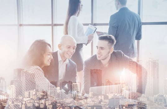 Young team of coworkers making great business discussion in modern coworking office. Teamwork people concept. Double exposition, panorama of modern city photo