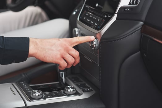 Man includes an audio system in the car. photo