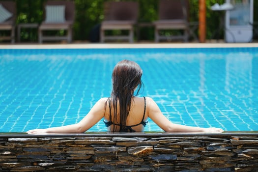 Beautiful southeast asia woman in pool relaxing. photo