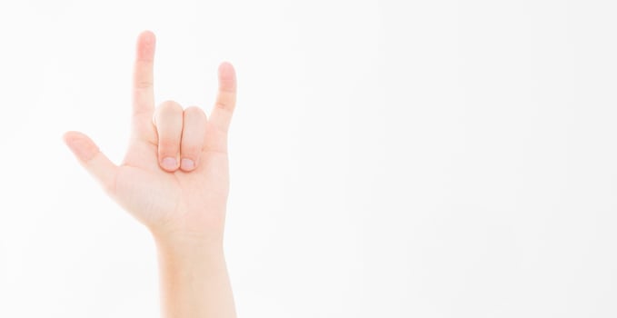 Man hand sign isolated on white background. Drive concept. Rock gesture, copy space. photo