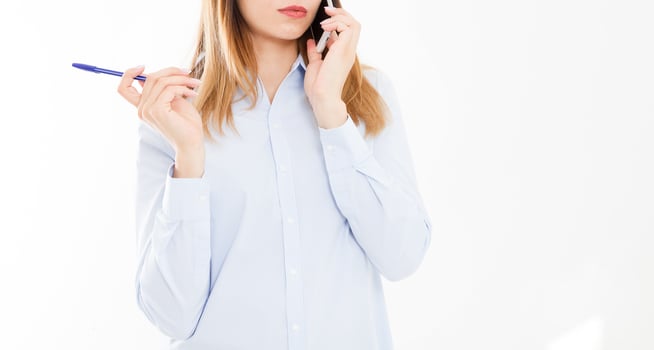 Isolated portrait of business girl with smartphone. Woman tolking on phone. Confident young manager. Copy space photo