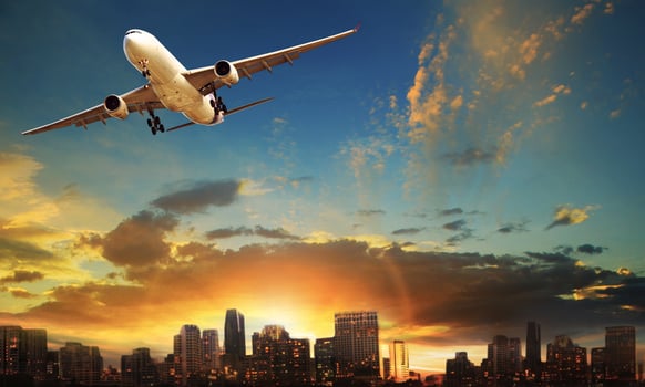 passenger plane departure against beautiful city building background photo