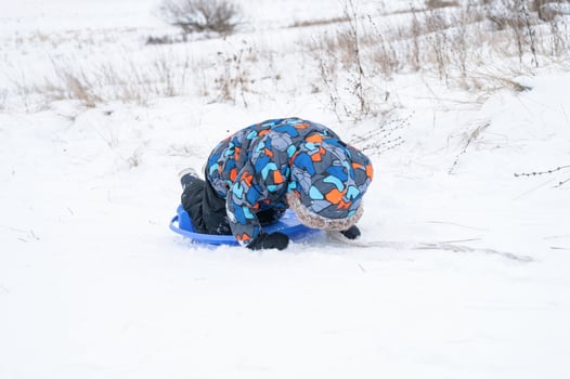 slide riding down kid winter activity photo