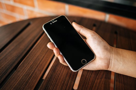 woman checking smartphone photo