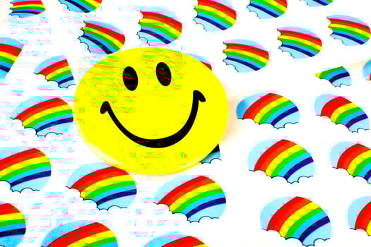 A smiley face on rainbow stickers. photo