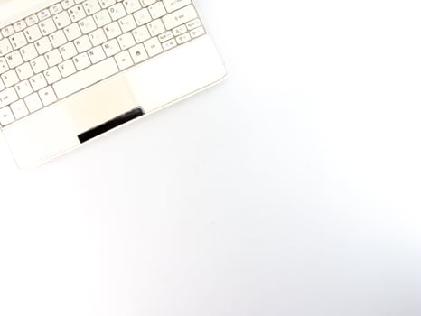 Top view of white laptop closeup on white background. photo