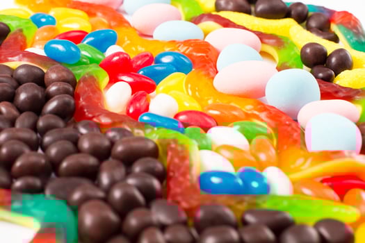 Colorful candy, lollipop and sweets isolated on white background. Top view. Selective focus. photo