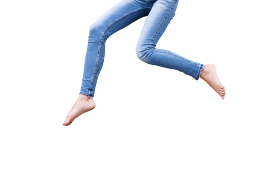 Female legs in blue fashion jeans isolated on white.Top view and copy space. photo