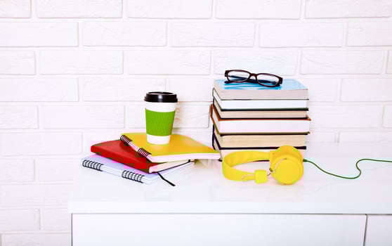 Workplace and education accessories on white table. Selective focus and copy space. Business school concept photo