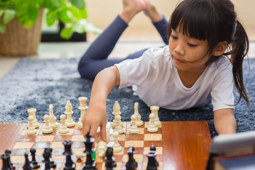 little girl having online chess lesson, e-education, distance learning photo