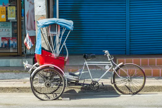Don Mueang Bangkok Thailand 2018 Old bike rickshaw rikshaw trishaw in Don Mueang Bangkok Thailand. photo