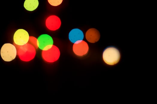 Colorful lights are shown in the dark photo
