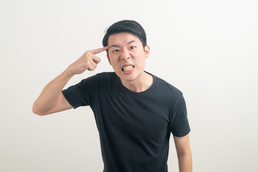young Asian man with angry and mad face photo