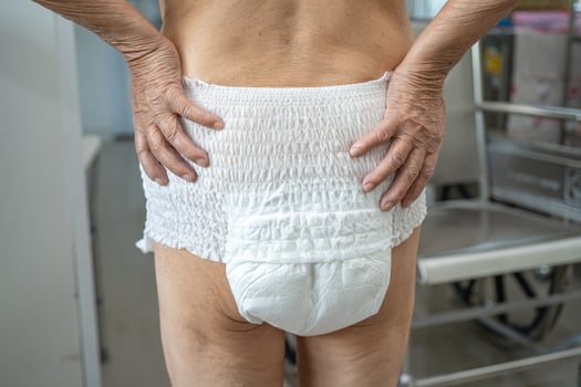 Asian senior or elderly old lady woman patient wearing incontinence diaper in nursing hospital ward, healthy strong medical concept. photo