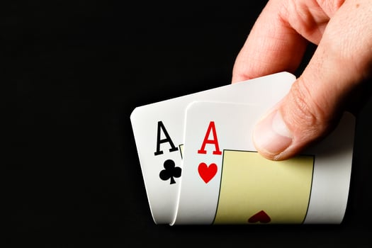 Hand holding two aces. photo