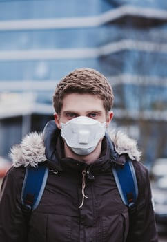 young man in a protective mask photo