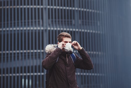 young man wears a protective mask photo