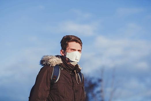 Young man with medical mask photo