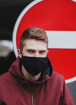 European man in a black protective mask photo