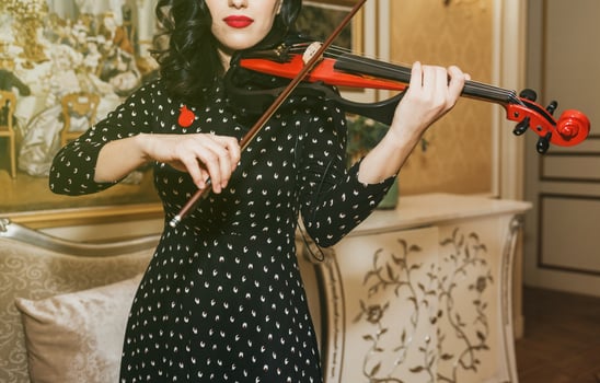 woman with red lips playing violin photo